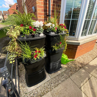 270 litre water butt with planters for front of house or patio.