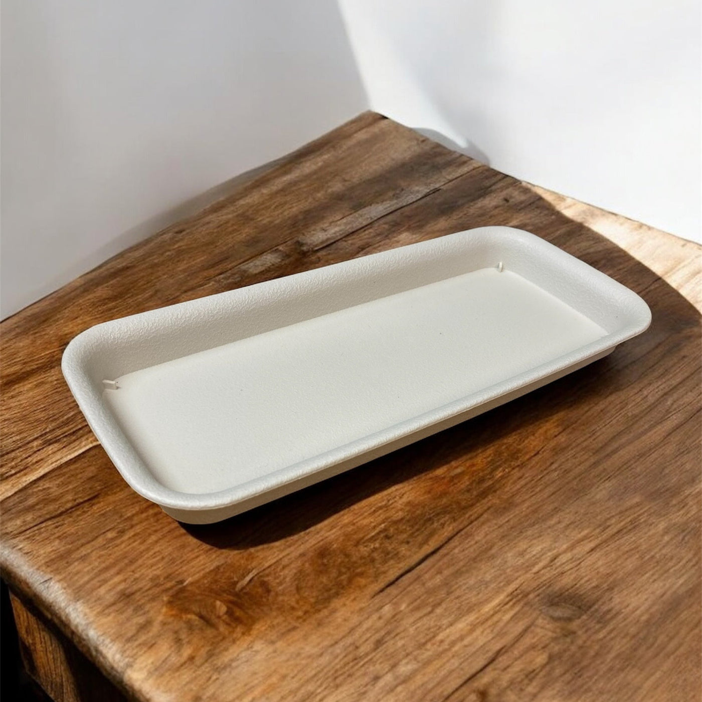 Ivory and neutral-coloured Rainwater Terrace planters displayed in a black drip tray, ideal for indoor seed growing on a windowsill or classroom table